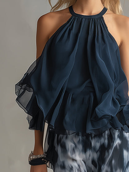 Conjunto elegante Bianca de Vega Madrid con blusa fluida y pantalón palazzo en tonos neutros.