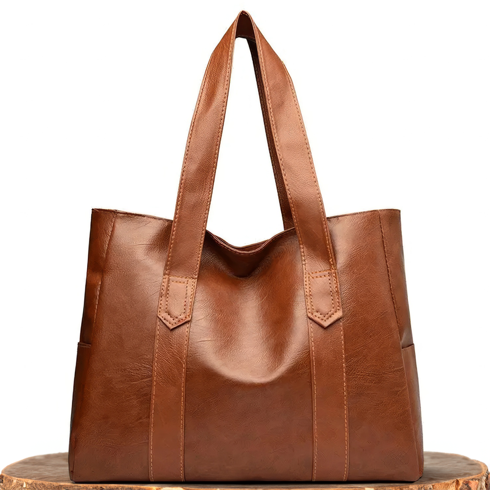 Bolso tote de piel Abigail de Vega Madrid, con diseño clásico y elegante, en color marrón y asa de mano resistente.