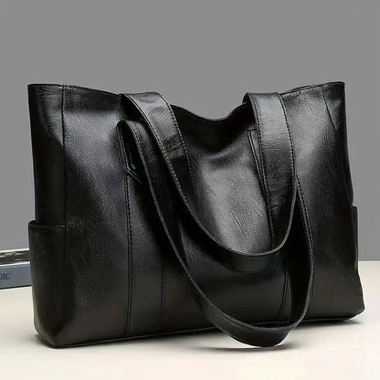 Bolso tote de piel Abigail de Vega Madrid, con asas elegantes y diseño clásico en color marrón.