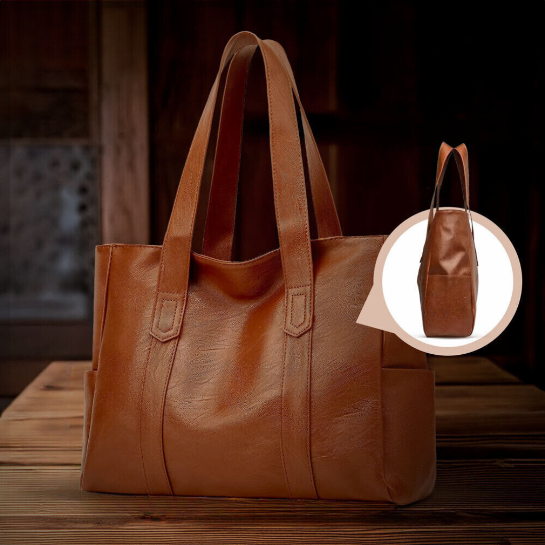 Bolso tote de piel Abigail de Vega Madrid, en color clásico, con asas robustas y diseño elegante para uso diario.