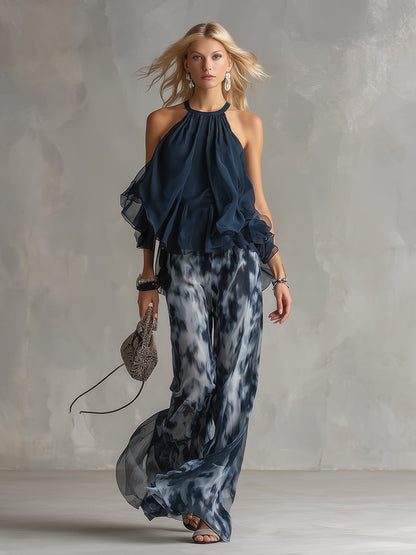 Conjunto elegante Bianca de Vega Madrid con blusa fluida y pantalón palazzo en color neutro, vista frontal del conjunto completo.