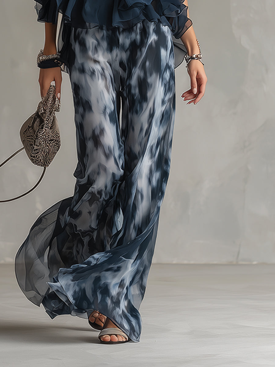 Conjunto elegante Bianca de Vega Madrid con blusa fluida y pantalón palazzo en tonos neutros, vista frontal sobre fondo blanco.